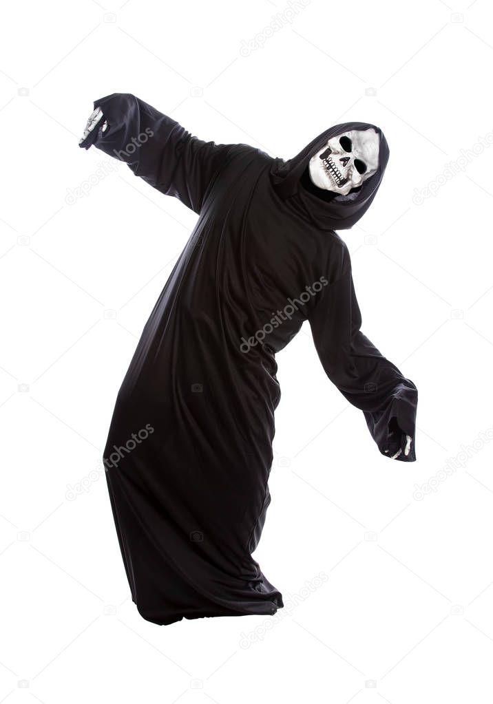 Halloween costume of a skeleton grim reaper wearing a black robe on a white background acting like getting hit or beat up by someone
