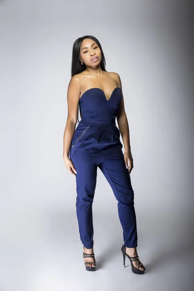 Sexy Black Female Fashion Model Wearing Apparel Blue Pants Outfit Stock  Photo by ©innovatedcaptures 187925408