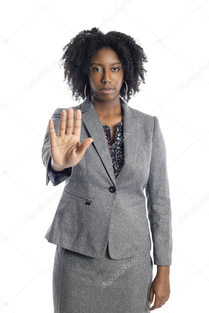 Black African American female businesswoman isolated on a white background doing a stop gesture