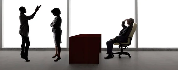 Black African American actress and scene partner auditioning for a role to a male casting director in a studio.  The actors are silhouettes and depicts the Hollywood entertainment industry.