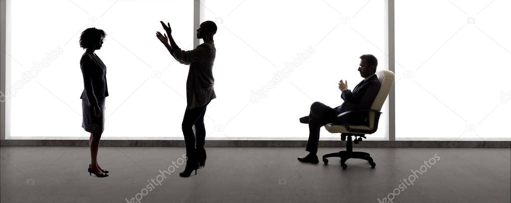 Black African American actress and scene partner auditioning for a role to a male casting director in a studio.  The actors are silhouettes and depicts the Hollywood entertainment industry.