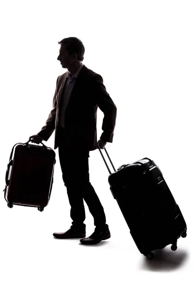 一个商人出差和携带行李旅行的剪影 那人提着包 准备在机场登机 — 图库照片