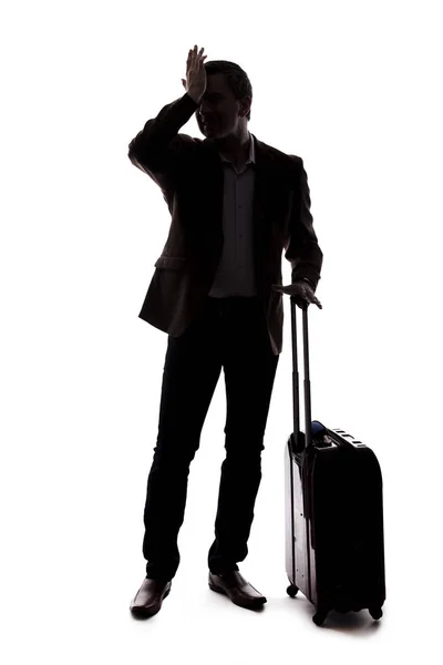 旅行商人的剪影 由于航班延误或取消而显得心烦意乱 旅客压力很大 提着行李等着 在白色背景上隔离 — 图库照片