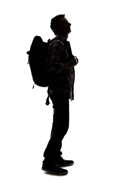Silhouette Eines Männlichen Reiseleiters Der Mit Einem Rucksack Auf Weißem — Stockfoto