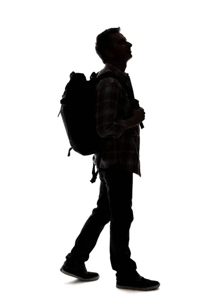 Silhouette Eines Männlichen Reiseleiters Der Mit Einem Rucksack Auf Weißem — Stockfoto