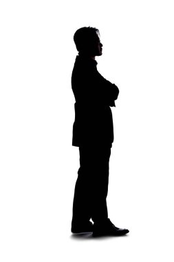 Beyaz arka planda izole edilmiş bir iş adamının tüm vücut silueti. Ayakta ve bekliyor ve sıkılmış veya sabırsız gibi duruyor..