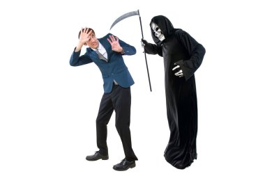 Man in a Halloween grim reaper ghost costume chasing, mocking and making fun of scared businessman running away.  Can also depict death following a man as a metaphor for life insurance.  clipart