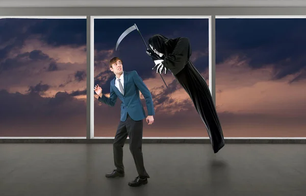 Man in a Halloween grim reaper ghost costume chasing, mocking and making fun of scared businessman running away.  Can also depict death following a man as a metaphor for life insurance.