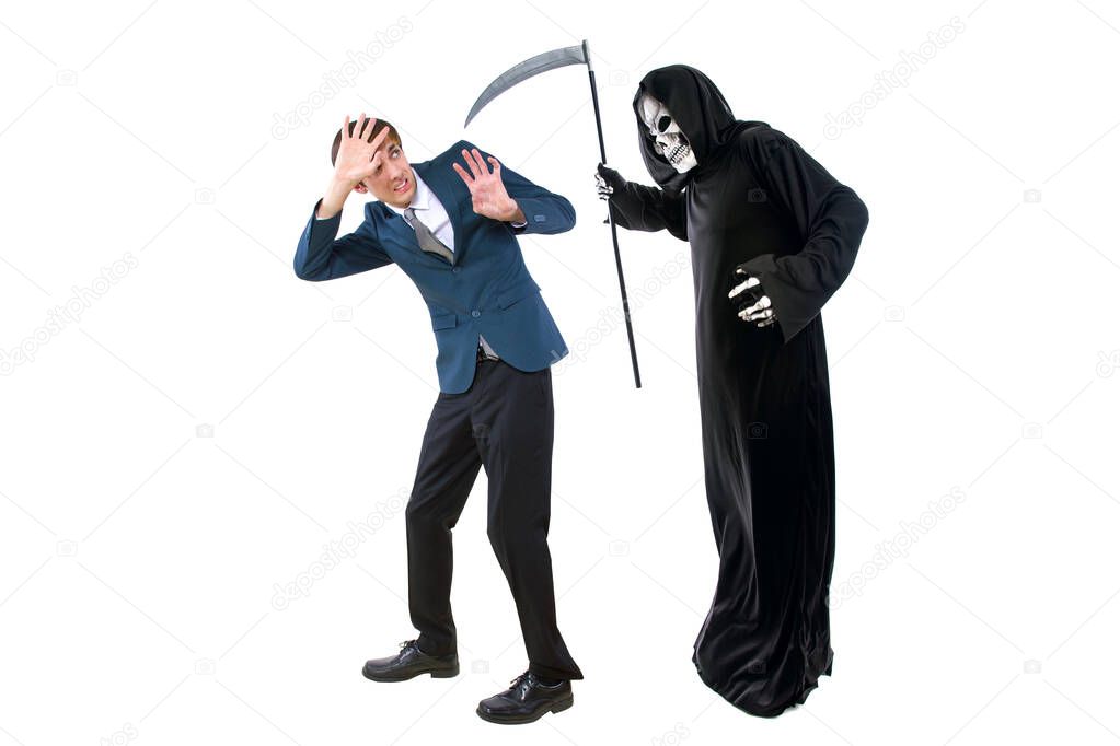 Man in a Halloween grim reaper ghost costume chasing, mocking and making fun of scared businessman running away.  Can also depict death following a man as a metaphor for life insurance. 