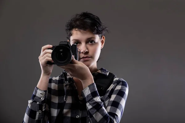 Young Female Photographer Holding Camera Studio She Posed Lit Background — Stock Photo, Image