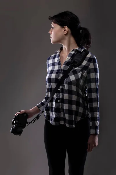 Young Female Photographer Holding Camera Studio She Posed Lit Background — Stock Photo, Image