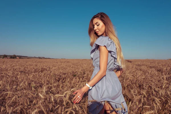 Woman summer wheat field, walks dress. Emotions happiness outdoor recreation village. Free space. Healthy nutrition concept, ecological product village, bio wheat. Collecting bread natural product. — Stock Photo, Image