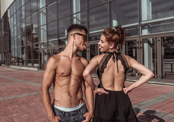 Young couple, guy girl, happy, smiling, play show languages each other, dancers, actors break dance hip-hop. In summer city. Active youth lifestyle, fitness, workout breakdancer concept passion love.