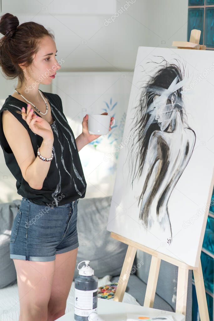beautiful woman holding paintbrush, mug coffee tea, serious looking drawing picture, silhouette girl, an easel. Home in workshop. Emotions fantasy, enjoyment creativity inspiration. Art painting.