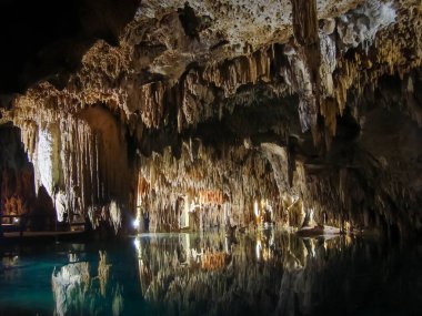 Beautiful , magical and amazing cave in Yucatan, Quintana Roo, Mexico. Reflection and nice formations clipart