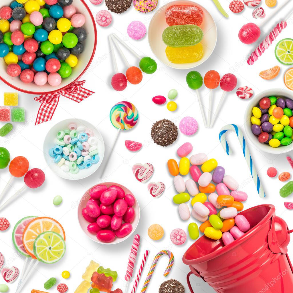 Lollipops and candies. Colorful sweets, festive decoration. Colorful candies on alight blue background, top view with copy space for message or greeting card. Concept of sweets and sugar.