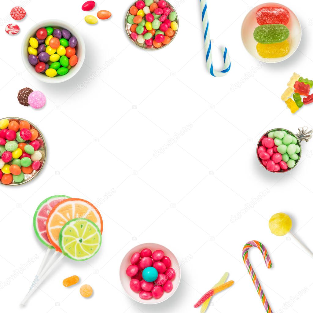 Lollipops and candies. Colorful sweets, festive decoration. Colorful candies on a white background, top view with copy space for message or greeting card. Concept of sweets and sugar.