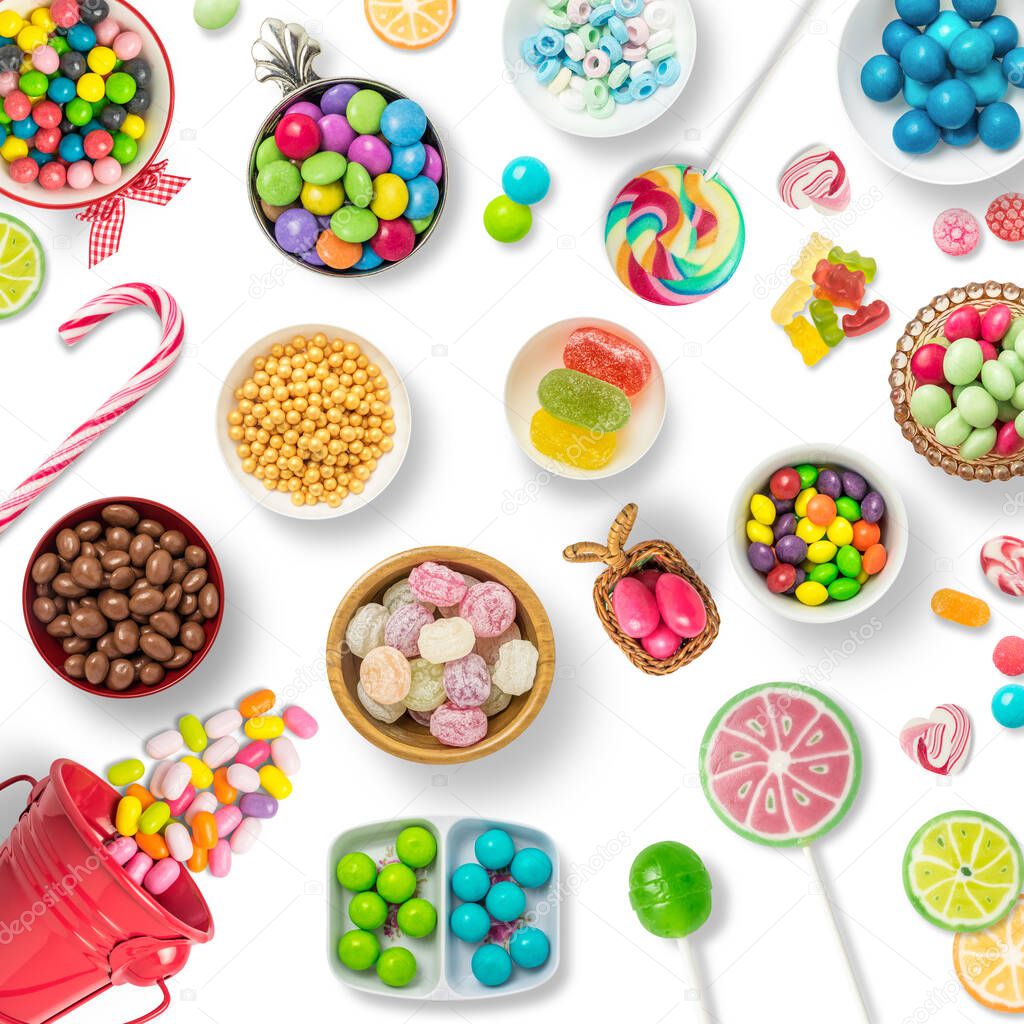 Candies, chocolates and lollipops on a white background background. Backdrop, banner o background with sweets. Top view of colorful sweets.