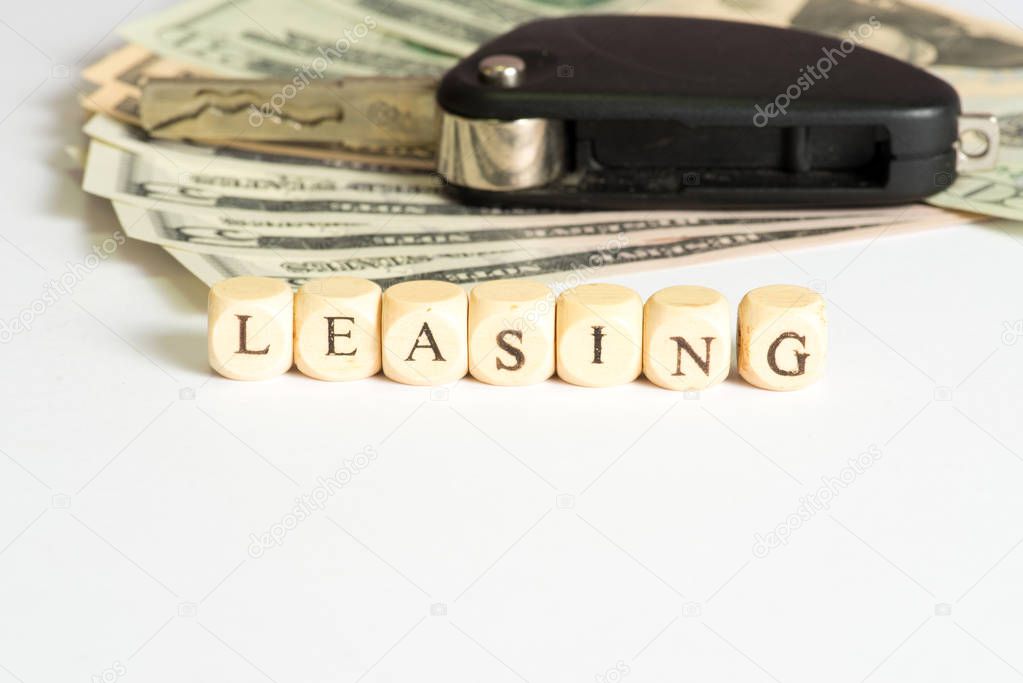 Leasing, dollar bills and a car key