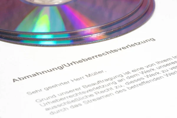 CD with pirated copies and a copyright infringement notice