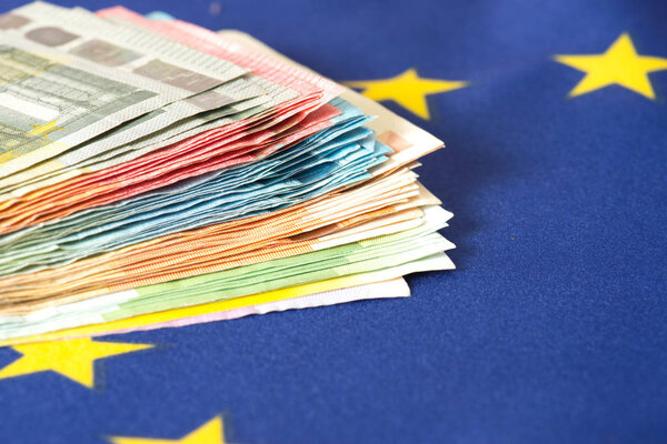 The flag of the EU and many Euro banknotes