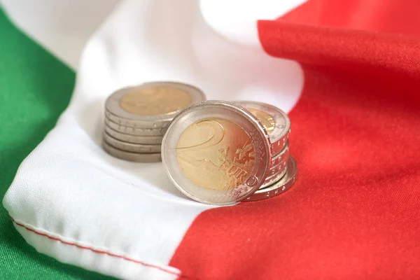 Euro coins and flag of Italy
