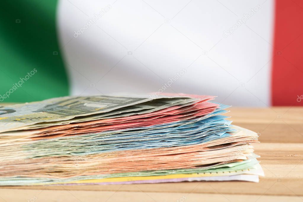 Flag of Italy and euro bills