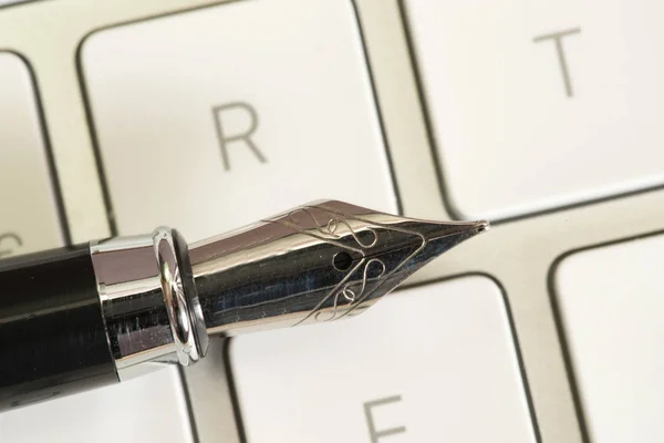 A fountain pen and a computer