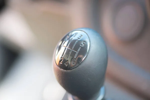 A gear knob for a manual transmission in a car