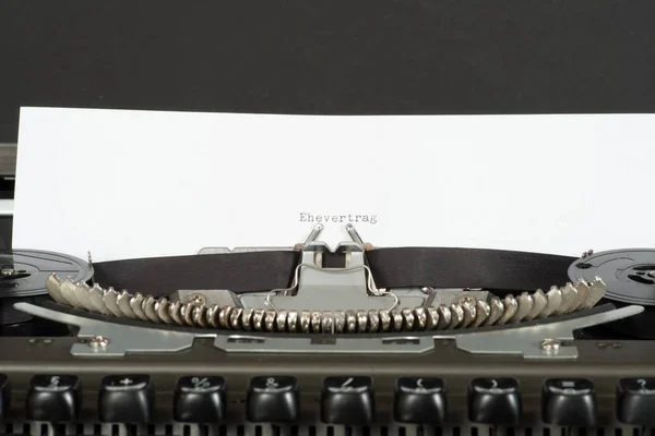 A typewriter and a marriage contract