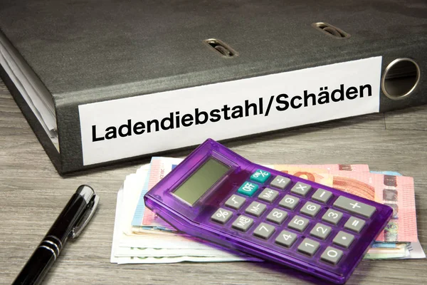 Euroscheine Taschenrechner Und Ein Ordner Mit Ladendiebstahlschaden — Stockfoto