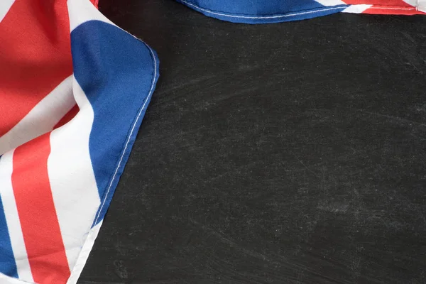 Flag of Great Britain and black chalk board as a template for the cultivation