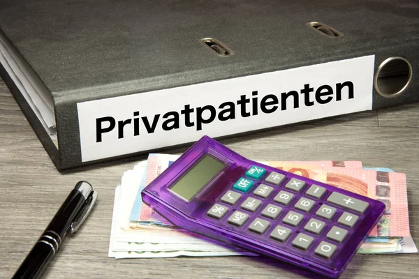 Calculator, euro bills and a folder with the imprint private patients