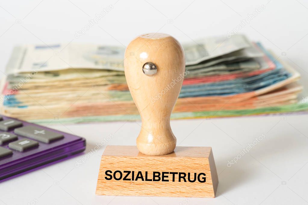Euro banknotes, calculator and stamp with the imprint Social fraud