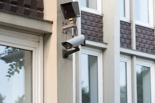 A security camera on a building