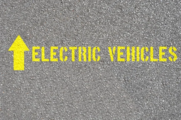 A road and an arrow showing the direction for electric cars