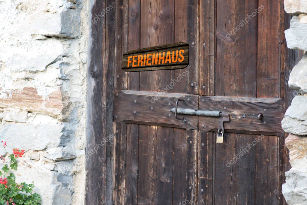 An old door and a sign cottage