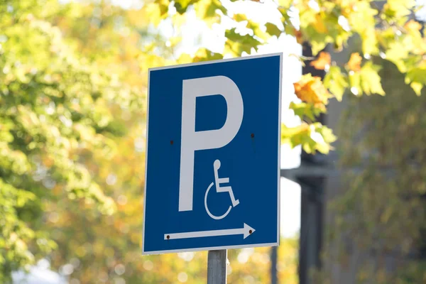 A sign indicating a disabled parking space