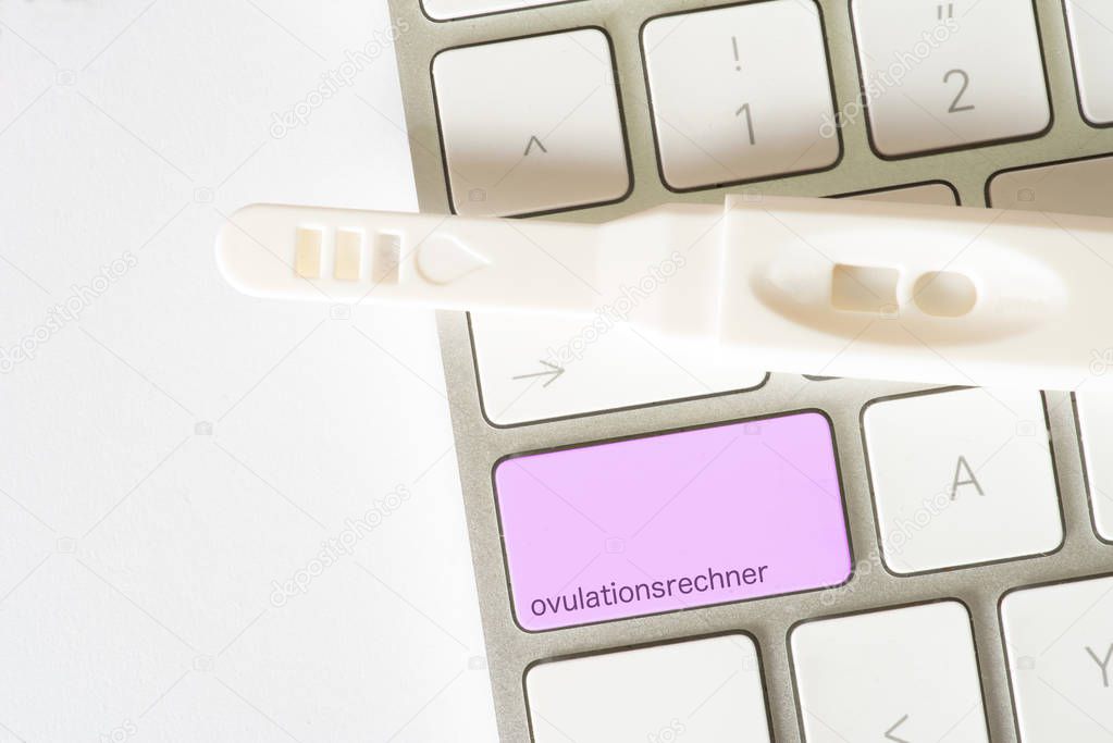 A computer, ovulation calculator and a pregnancy test