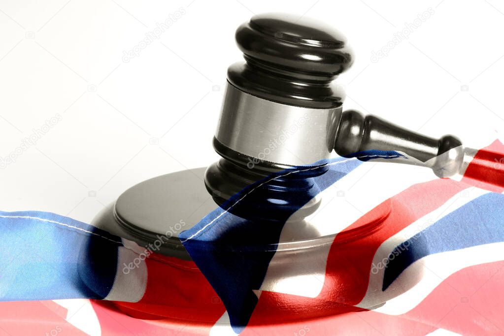 Judge's gavel and flag of Great Britain