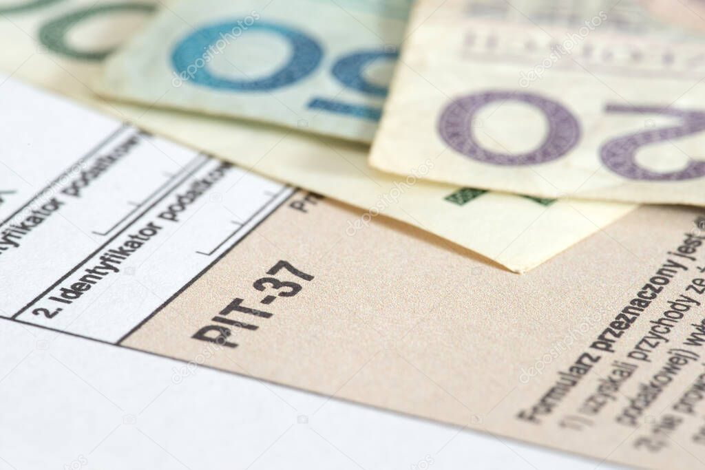 PIT form for tax returns in Poland and Polish zloty banknotes