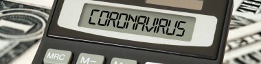 Hesap makinesi, dolar banknotları ve koronavirüs