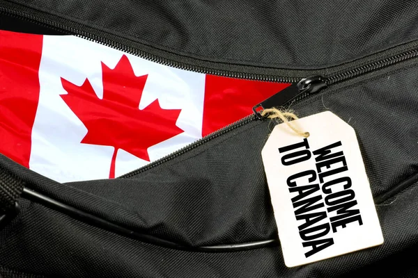 Eine Tasche Und Ein Schild Willkommen Kanada — Stockfoto