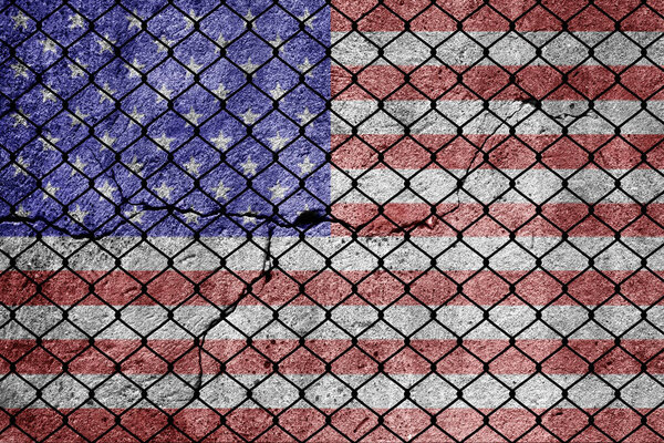 Flag of USA and a fence on the border