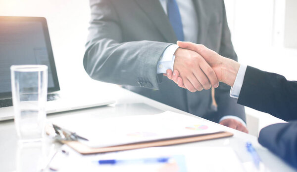 Business people shaking hands, finishing up a meeting