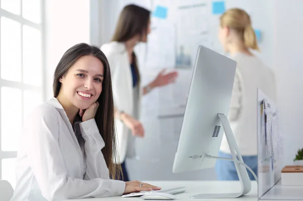 Attractive business woman working on laptop at office. Business people — Stock Photo, Image