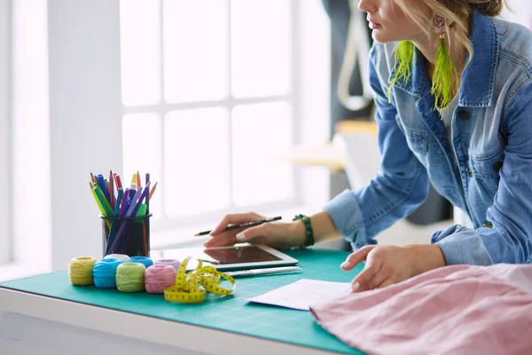 Fashion designer woman working on her designs in the studio — Stock Photo, Image