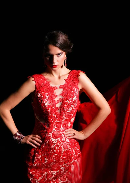 Pretty young model female with dark hair in amazing long red dress — Stock Photo, Image