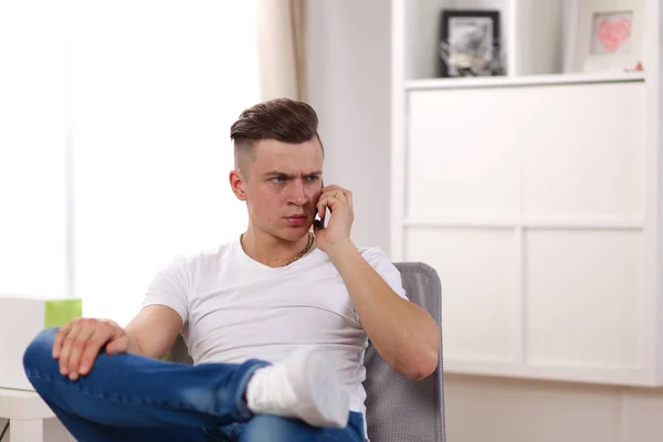 Young man resting in armchair. Joy of life — Stock Photo, Image