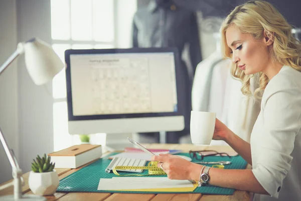 Fashion designer woman working on her designs in the studio — Stock Photo, Image